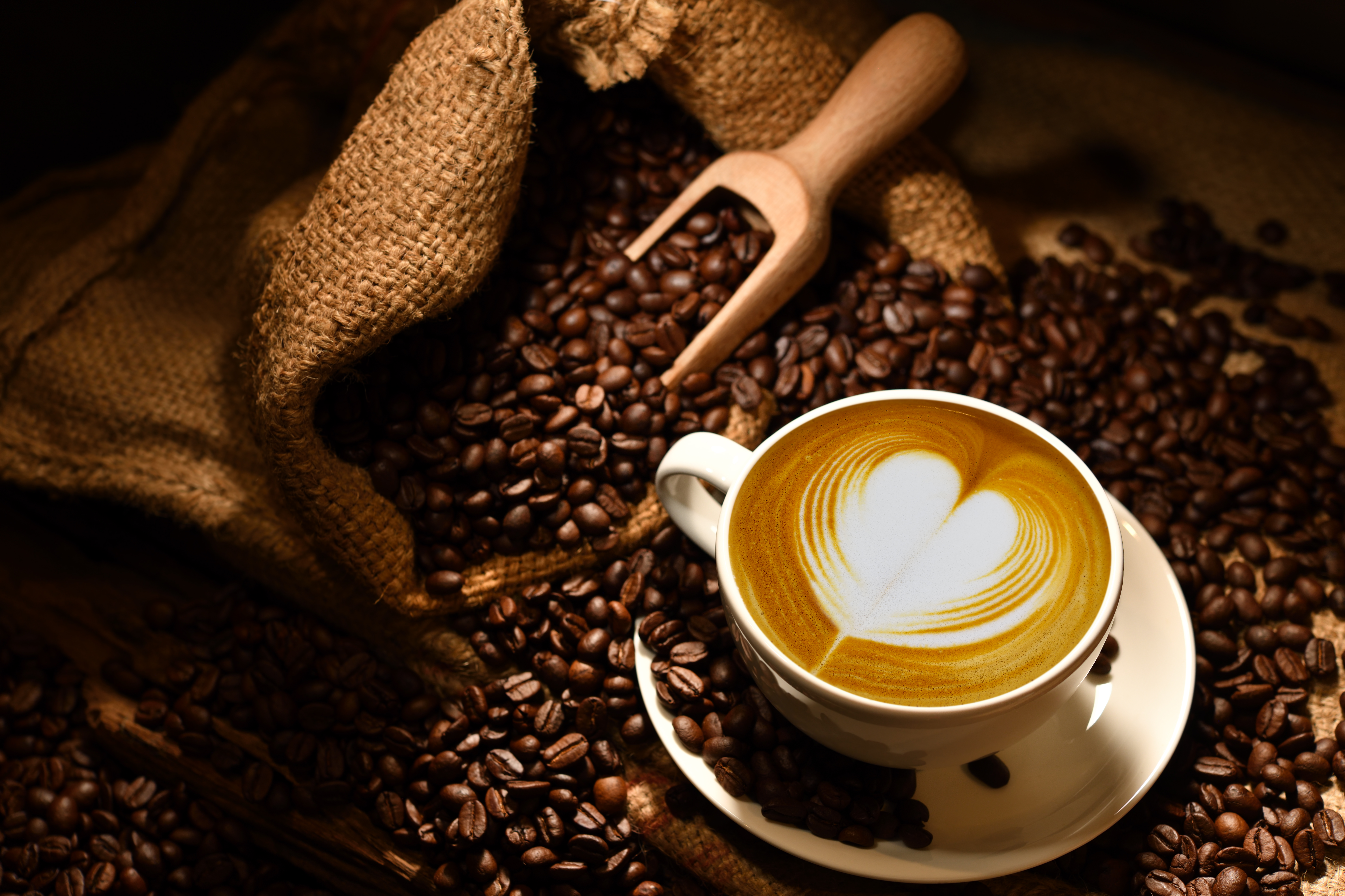 latte art and coffee beans in rustic setting 2026 03 16 23 02 49 utc