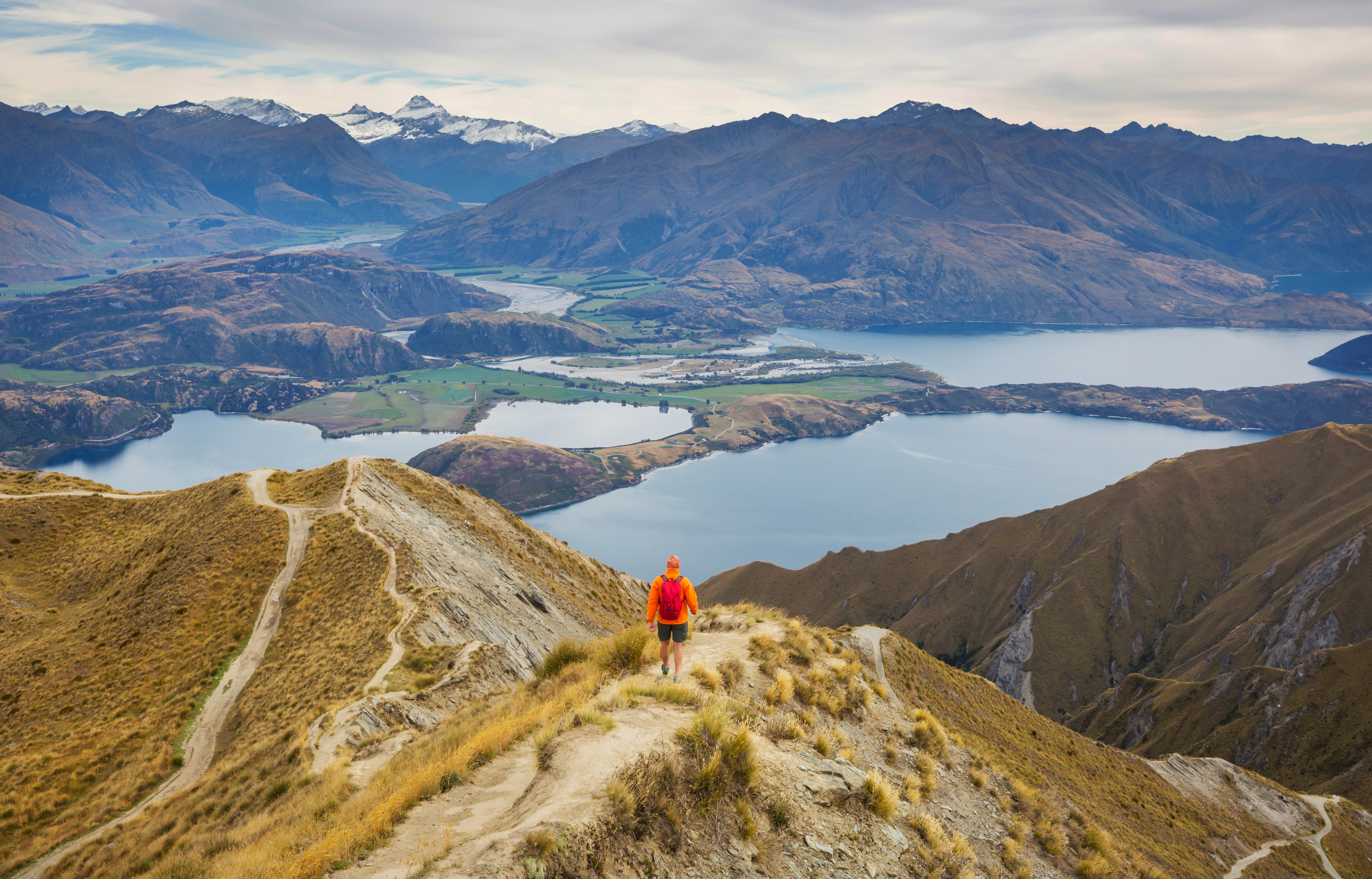 The best hikes, walks and mountain views in New Zealand scenic hiker on ridge with mountain lake view 2026 03 17 05 57 59 utc
