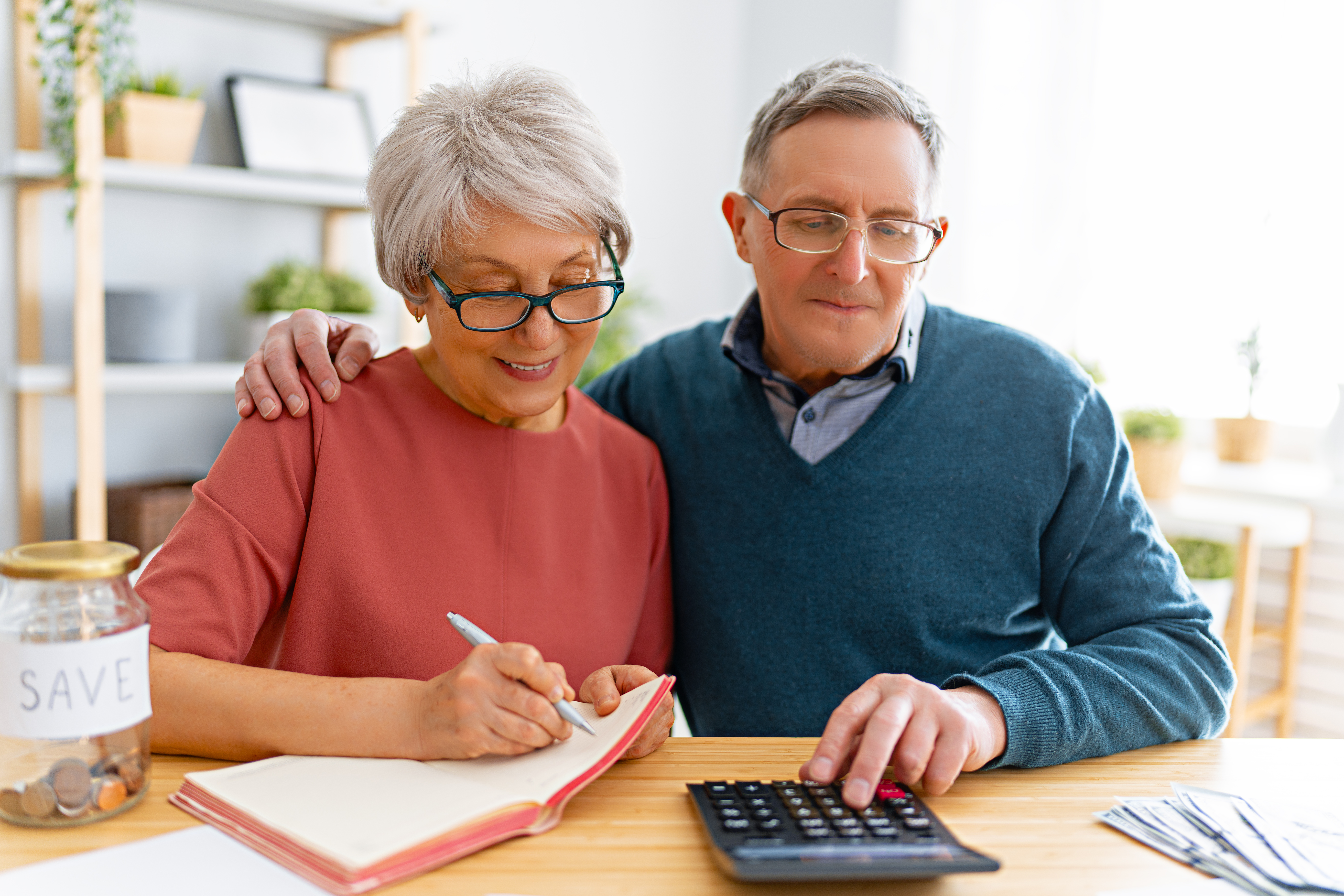 What is KiwiSaver in New Zealand? senior couple planning budget at table indoors 2026 03 11 01 03 21 utc