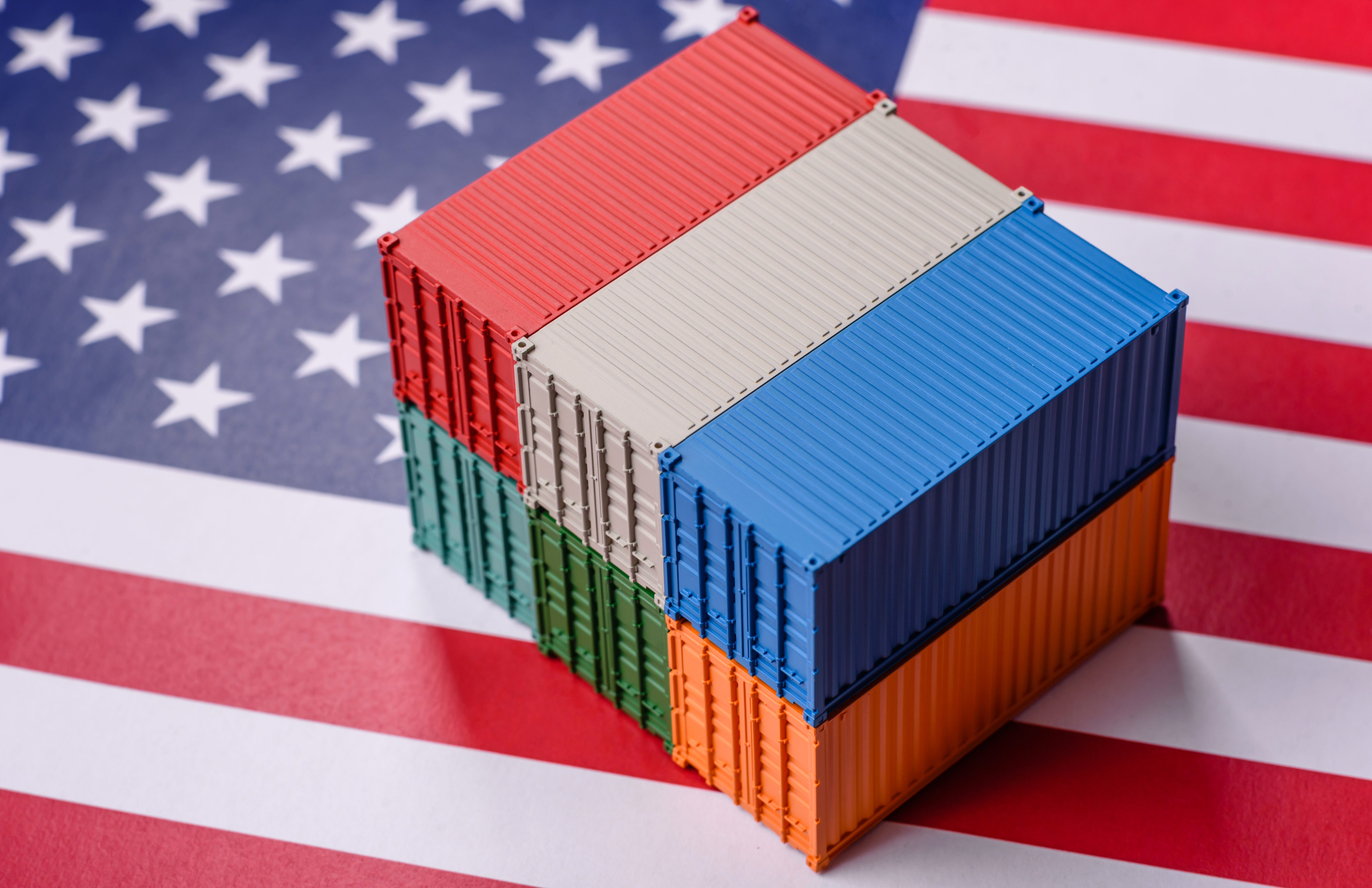 shipping containers stacked on an american flag ba 2026 01 12 18 40 14 utc