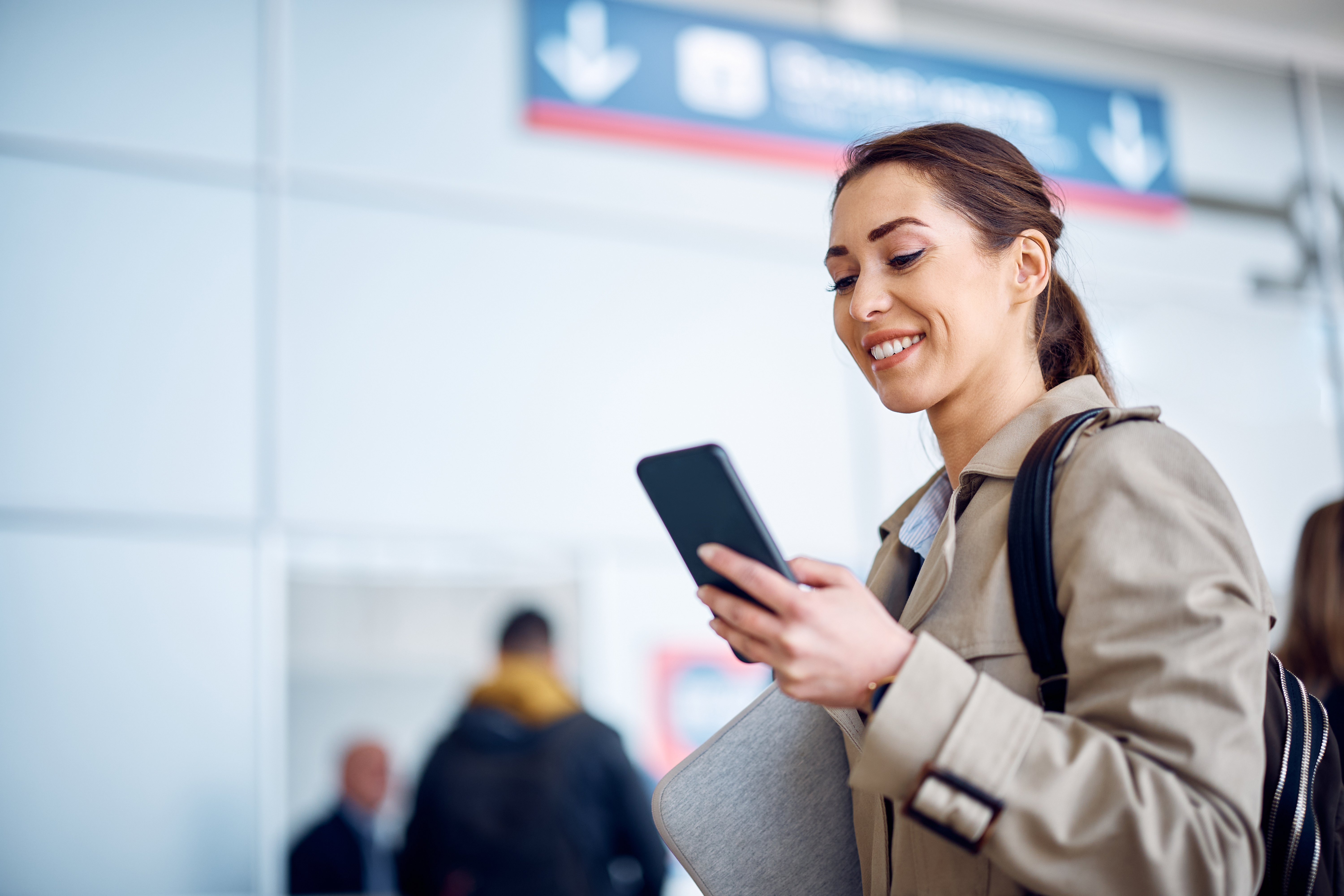 happy businesswoman checking schedule of her trans 2026 01 06 10 30 33 utc