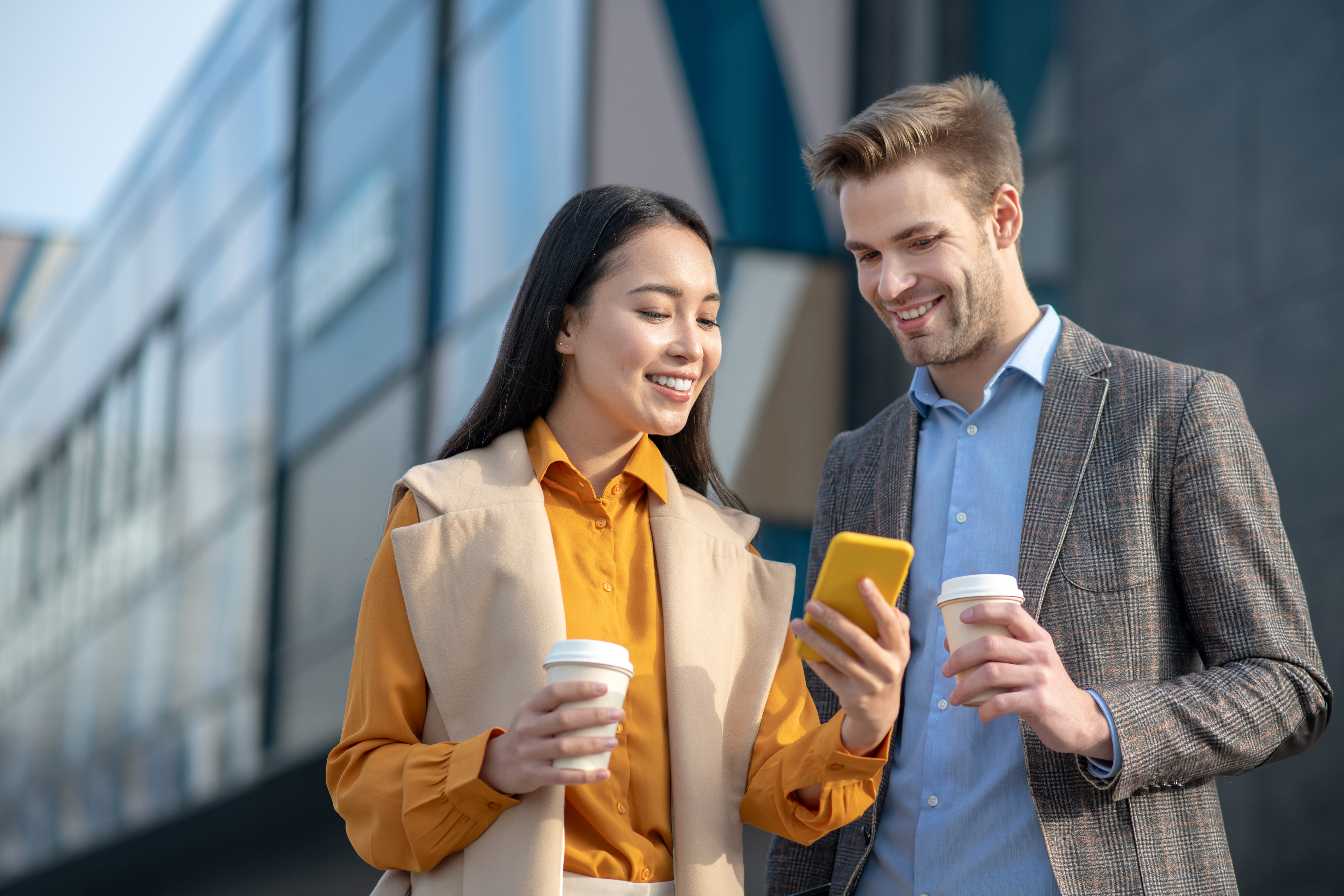 smiling man and woman looking at phone together 2026 01 05 04 51 31 utc