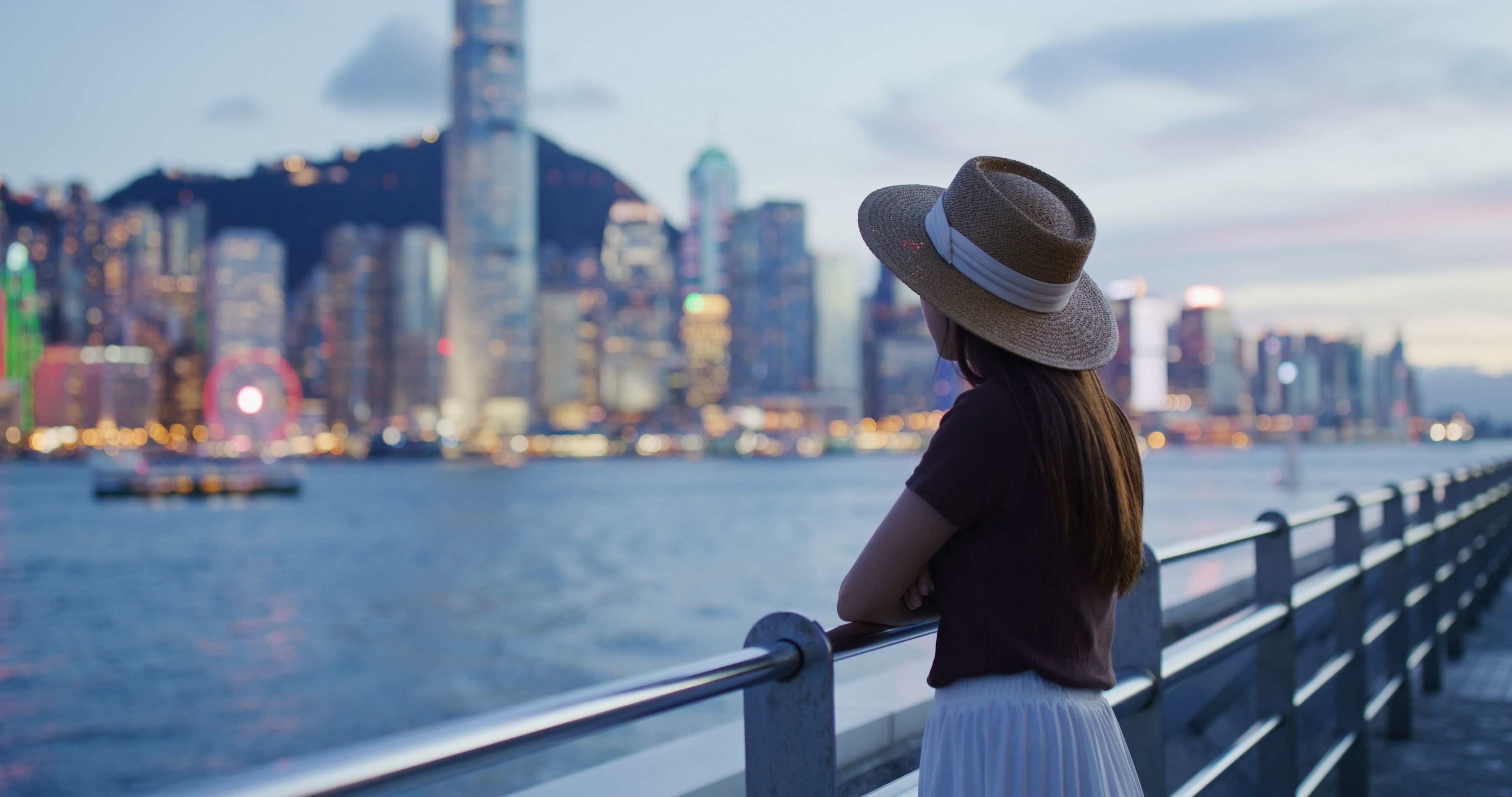 woman enjoy the view of hong kong at sunset 2026 03 24 21 49 24 utc