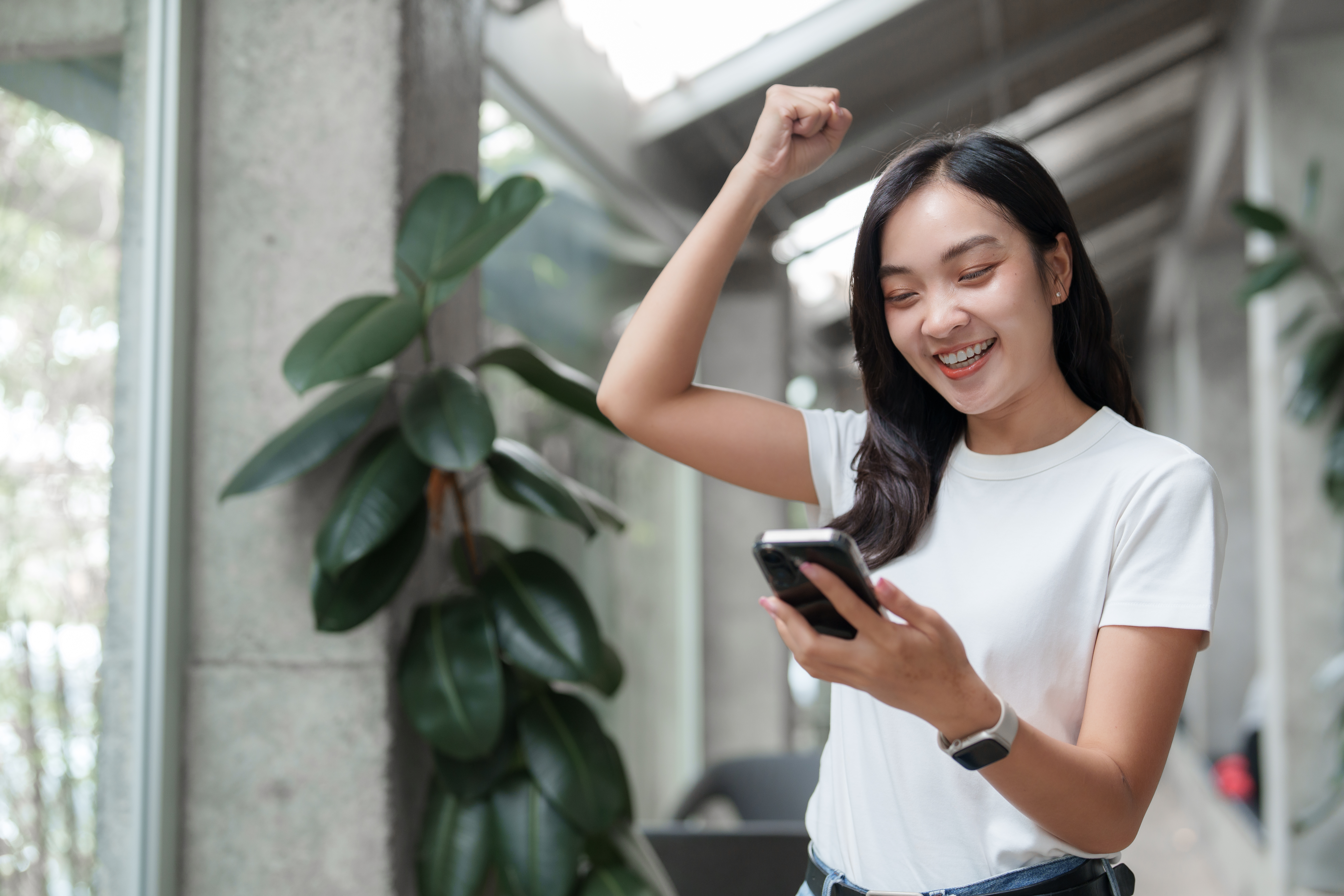 Cheapest ways to send money to Vietnam from Australia enthusiastic woman celebrates success with mobile 2026 03 25 10 07 00 utc