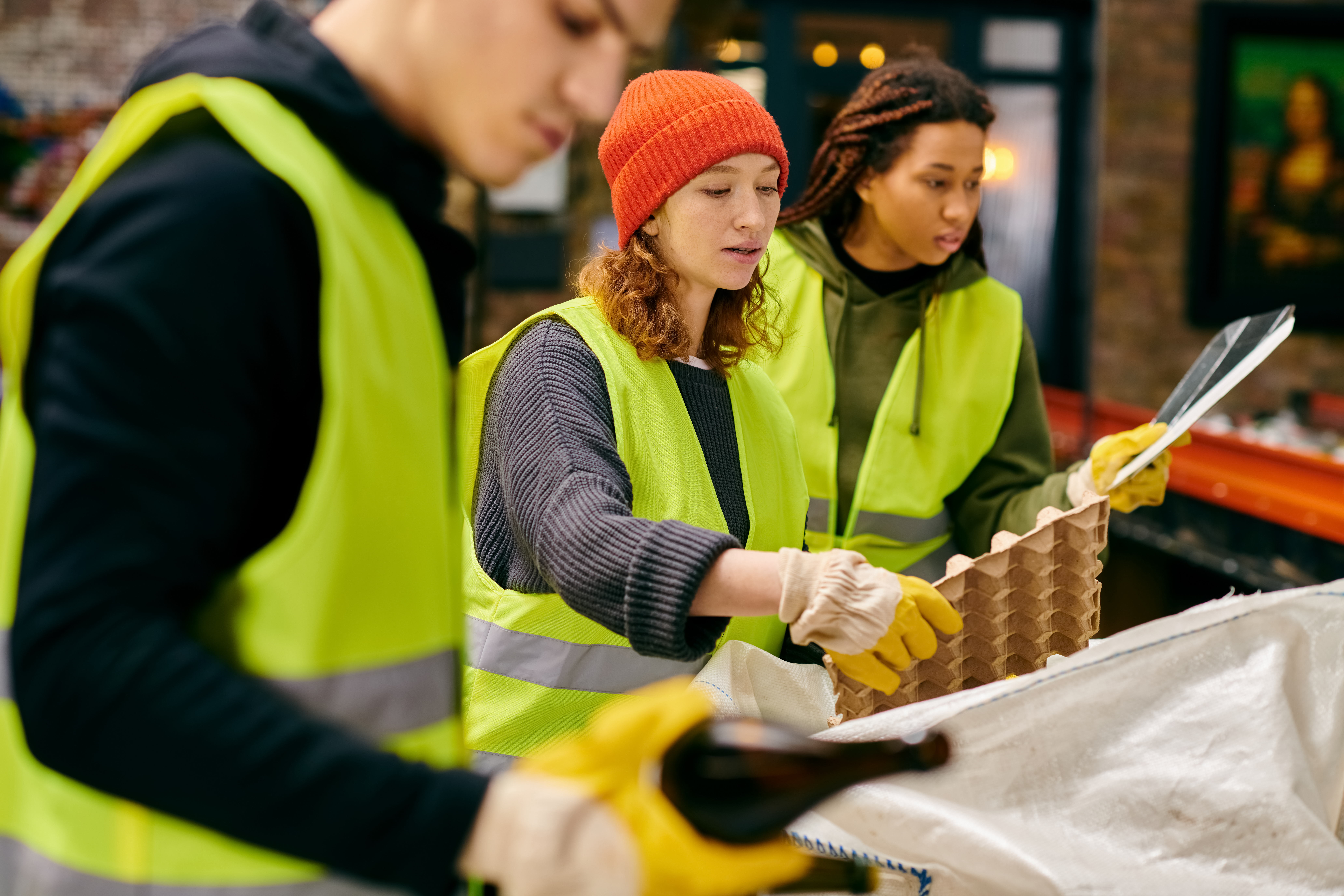 recycling plant workers sort materials together 2026 01 06 00 07 52 utc