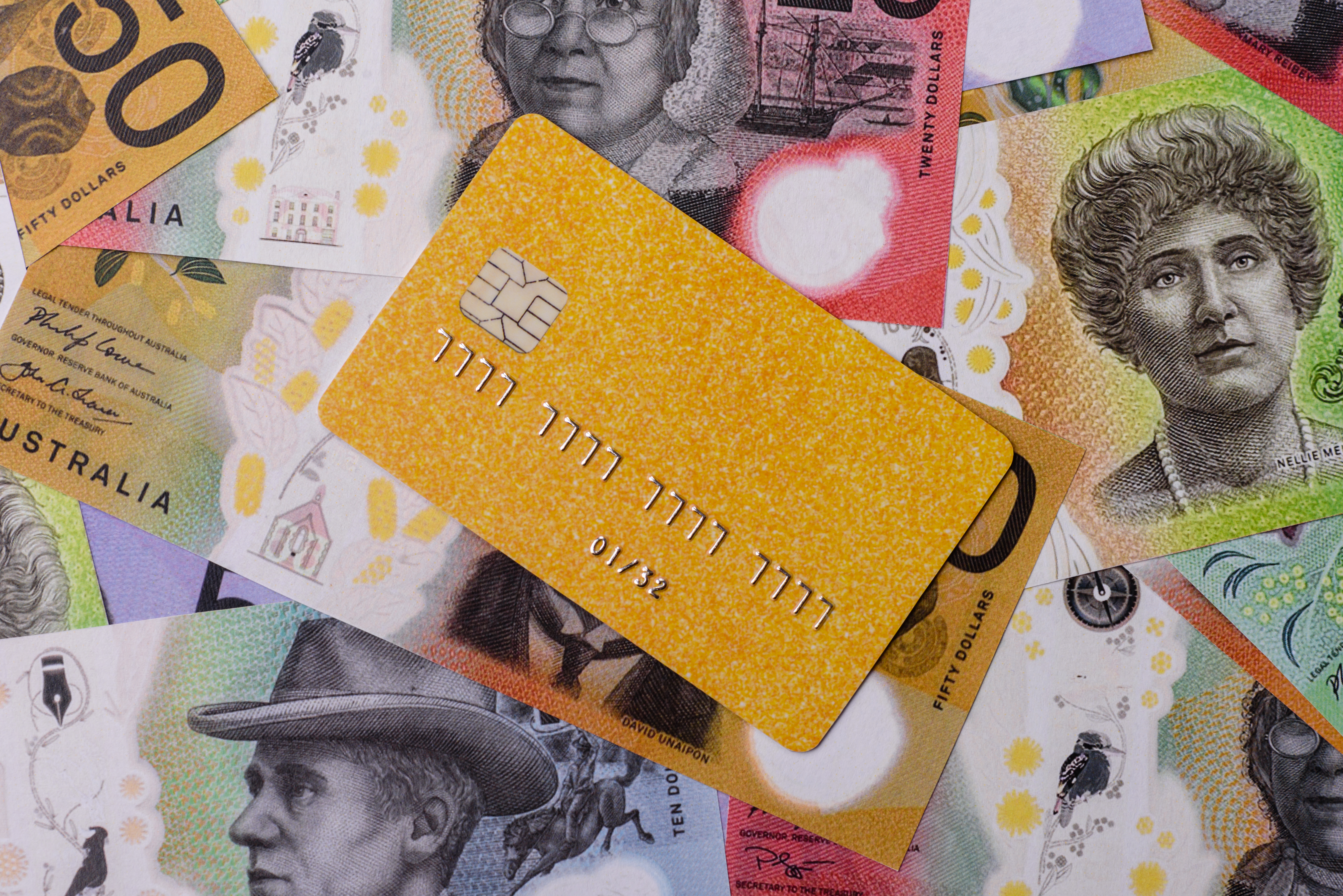 yellow credit card resting on australian dollar ba 2026 06 25 19 46 30 utc